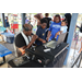 DJ Dondy and a child wearing a dark blue shirt at the Spring Family Picnic event in Jordan Park on March 26, 2024.