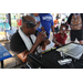 DJ Dondy and child wearing dark red shirt at the Spring Family Picnic event in Jordan Park on March 26, 2024.