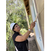 St. Petersburg Housing Authority (SPHA) woman painting Habitat for Humanity house.