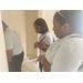 A team from the St. Petersburg Housing Authority (SPHA) measuring inside house walls.