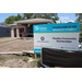 Outside of Habitat for Humanity house under construction with Habitat for Humanity sign in front.
