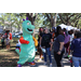 Great Explorations dinosaur mascot at Spring Family Picnic in Jordan Park.