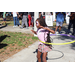 Girl with face painted hula-hooping at Spring Family Picnic in Jordan Park.