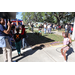 People and girl with face painted hula-hooping at Spring Family Picnic in Jordan Park.