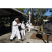 Shihan School of Survival students with one showcasing their martial arts kicking skills with Shihan Walter Evans at Spring Family Picnic in Jordan Park.