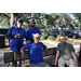 Four SPHA team members at park bench Spring Family Picnic in Jordan Park.