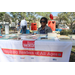 Woman seated at Read Strong Pinellas table at Spring Family Picnic in Jordan Park.