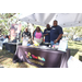 People at The HUB table at Spring Family Picnic in Jordan Park.