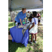  Tampa Bay Watch Discovery Center team member talking to people at Back to School Event in Jordan Park 2025. 