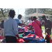  SPHA team members handing out backpacks at Back to School Event in Jordan Park 2025. 