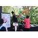  Man wearing a top hat and making a balloon creation at Back to School Event in Jordan Park 2025. 