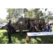  St. Petersburg Police Department vehicle and police officers smiling at Back to School Event in Jordan Park 2025. 