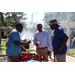  Mr. Lundy and two SPHA team members talking at Back to School Event in Jordan Park 2025. 