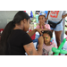  A child having their face painted at Back to School Event in Jordan Park 2025. 