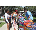  Family at backpack table at Back to School Event in Jordan Park 2025. 
