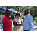  Three people at Back to School Event in Jordan Park with tents in the background. 