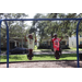  Two children playing on swings at Back to School Event in Jordan Park 2025. 