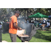  Man cooking hamburgers at grill at Back to School Event in Jordan Park 2025. 
