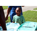  Young boy smiling at Back to School Event in Jordan Park 2025. 