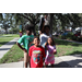  Family of four at Back to School Event in Jordan Park with green grass in the background. 