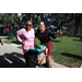 Two people at Back to School Event in Jordan Park with green grass in the background. 