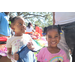  Two young girls smiling at Back to School Event in Jordan Park 2025. 