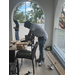  Student cutting wood outside at Summer Construction Camp 2025. 