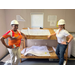  Two women wearing hardhats. 