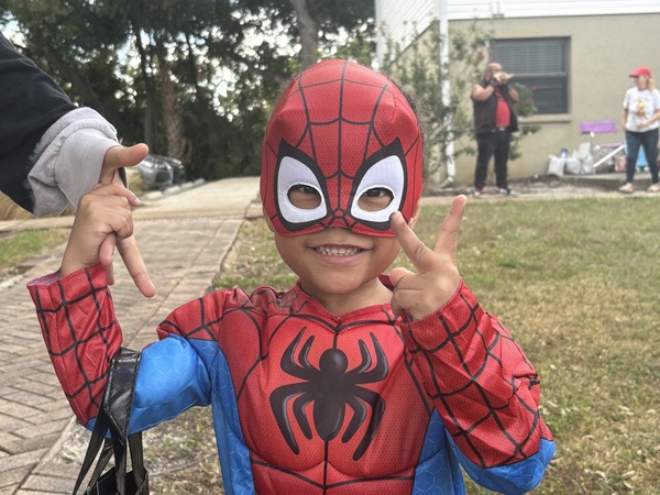 Child dressed in Spider-Man costume at Trunk or Treat event.