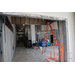  Interior of The Edward White Campus, a ladder, and construction equipment. 