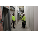  Two construction workers inside The Edward White Campus. 