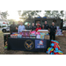  St. Petersburg Police Department (SPPD) officers and St. Petersburg Housing Authority (SPHA) team members standing by table with toys. 