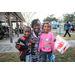  Family smiling at the Very Merry Holiday Party in Jordan Park. 