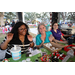  Three people smiling at the Very Merry Holiday Party in Jordan Park. 