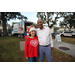  Two people in front of the Positive Impact ST. PETE truck at the Very Merry Holiday Party in Jordan Park. 