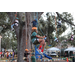  Children participating in a tree climb activity at the Very Merry Holiday Party in Jordan Park. 