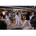  Martial arts instructor and students with arms up at the Very Merry Holiday Party in Jordan Park. 