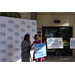  Danielle Thomas, SPHA Sr. Vice President / COO, speaking at a microphone, with U.S. Rep. Kathy Castor standing next to her. 