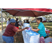  A SPHA team member handing pizza to a resident at the Spring Family Picnic event in Jordan Park on March 10, 2026. 