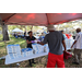 SPHA team member handing out pizza at the Spring Family Picnic event in Jordan Park on March 10, 2026. 