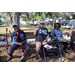  Three SPHA residents sitting on a bench at the Spring Family Picnic event in Jordan Park on March 10, 2026. 