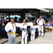  Youth martial arts students with their left arm extended  at the Spring Family Picnic event in Jordan Park on March 10, 2026. 